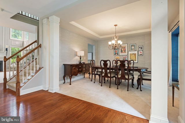 16 Fox Hollow Dr, Lancaster, PA 17602 - dining space with wood finished floors, stairs, wallpapered walls, a chandelier, and ornate columns