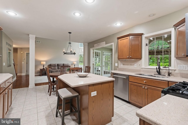 16 Fox Hollow Dr, Lancaster, PA 17602 - kitchen with dishwasher, a kitchen island, brown cabinets, plenty of natural light, and recessed lighting