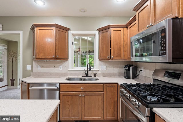 16 Fox Hollow Dr, Lancaster, PA 17602 - kitchen with appliances with stainless steel finishes, light countertops, backsplash, recessed lighting, and brown cabinetry