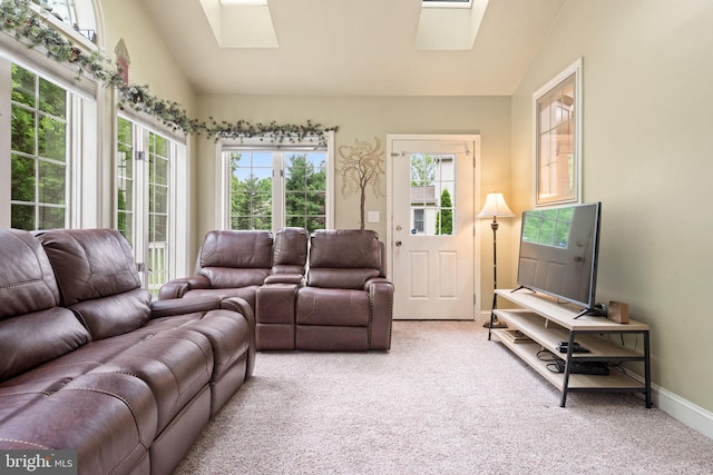 16 Fox Hollow Dr, Lancaster, PA 17602 - living room featuring a skylight, vaulted ceiling, carpet, and healthy amount of natural light