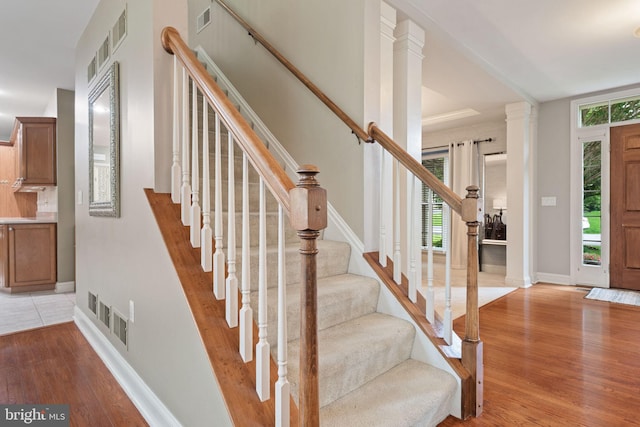 16 Fox Hollow Dr, Lancaster, PA 17602 - entrance foyer with light wood finished floors, stairs, and ornate columns