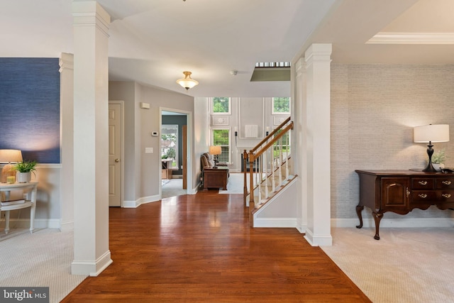 16 Fox Hollow Dr, Lancaster, PA 17602 - foyer entrance with an accent wall, decorative columns, stairs, wallpapered walls, and wood finished floors