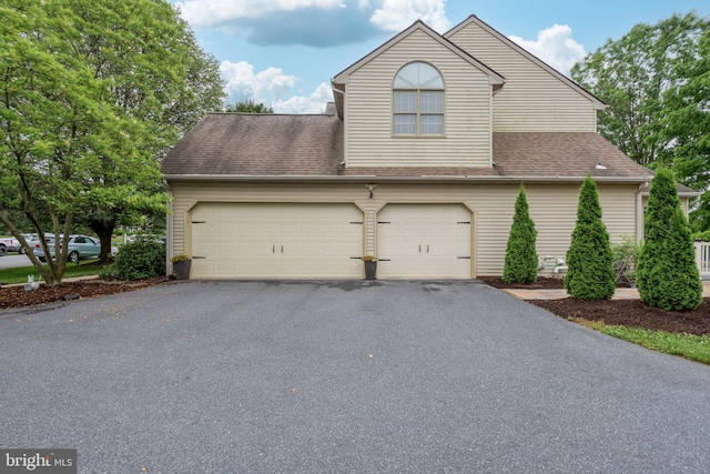 16 Fox Hollow Dr, Lancaster, PA 17602 - view of front of house with driveway, an attached garage, and a shingled roof