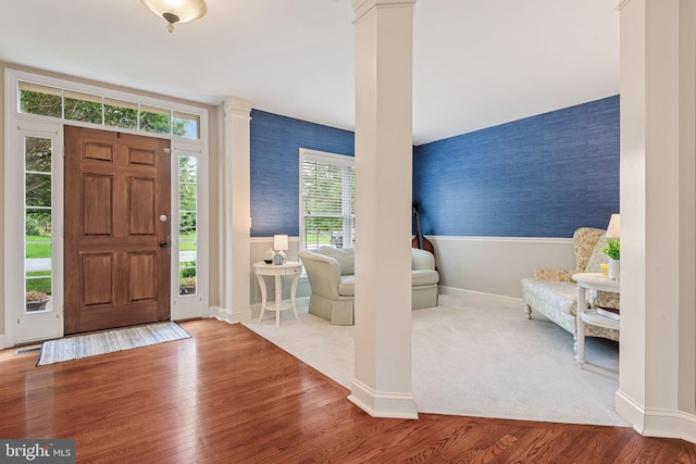 16 Fox Hollow Dr, Lancaster, PA 17602 - entryway featuring wallpapered walls, ornate columns, and wood finished floors