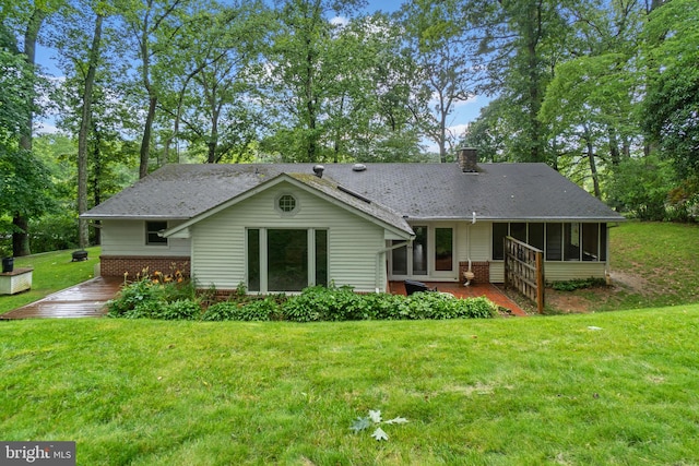 643 Meadow Branch Rd, Westminster, MD 21158 - back of house featuring a sunroom, a chimney, a lawn, brick siding, and a deck