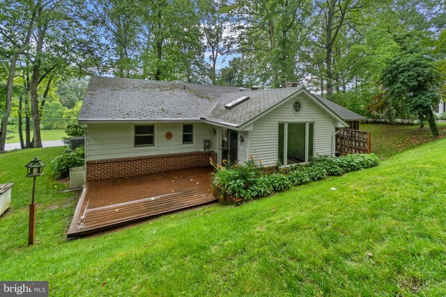 643 Meadow Branch Rd, Westminster, MD 21158 - back of house featuring a lawn, a deck, and a chimney