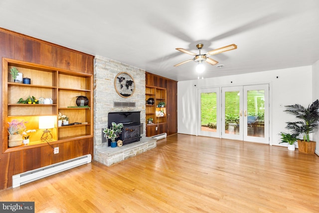 643 Meadow Branch Rd, Westminster, MD 21158 - living room with a baseboard heating unit, a ceiling fan, wood finished floors, and built in shelves