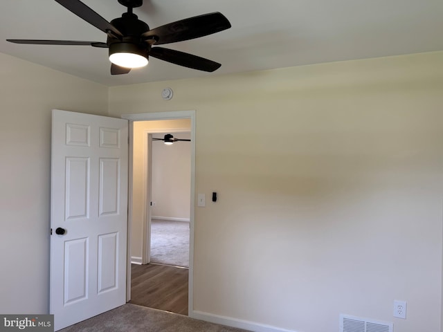313 W Third St, Camden Wyoming, DE 19934 - unfurnished room with ceiling fan, a smoke detector, wood finished floors, and carpet floors