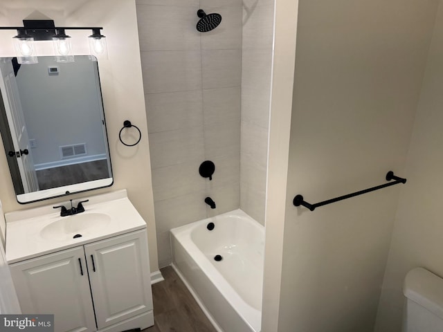 313 W Third St, Camden Wyoming, DE 19934 - full bathroom with wood finished floors, vanity, and tub / shower combination