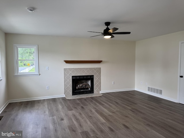 313 W Third St, Camden Wyoming, DE 19934 - unfurnished living room featuring ceiling fan, dark wood-style floors, and a fireplace