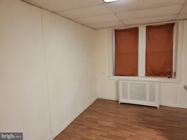 33 S Iowa Unit B1, Atlantic City, NJ 08401 - unfurnished room with radiator heating unit, a paneled ceiling, and wood finished floors