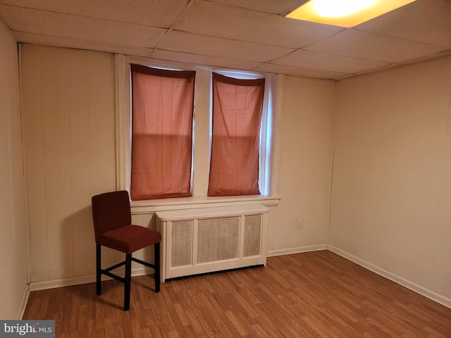 33 S Iowa Unit B1, Atlantic City, NJ 08401 - spare room with radiator heating unit, wood finished floors, and a paneled ceiling