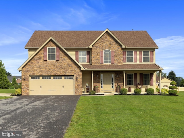 647 Warm Spring Rd, Chambersburg, PA 17202 - view of front facade with an attached garage, asphalt driveway, a front yard, covered porch, and a shingled roof