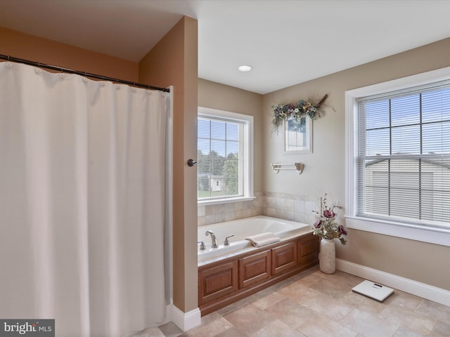 647 Warm Spring Rd, Chambersburg, PA 17202 - bathroom featuring a garden tub, curtained shower, and tile patterned floors
