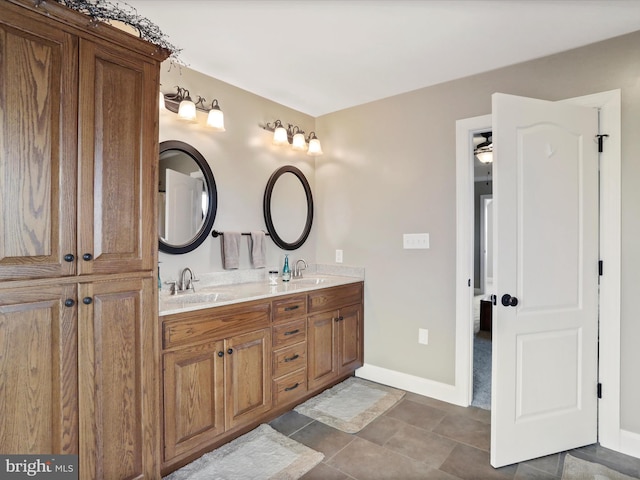 647 Warm Spring Rd, Chambersburg, PA 17202 - bathroom featuring baseboards and double vanity