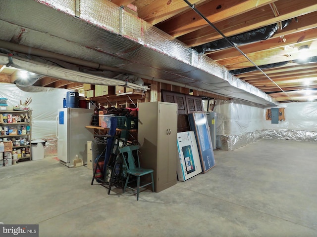 647 Warm Spring Rd, Chambersburg, PA 17202 - unfinished below grade area with water heater, electric panel, and freestanding refrigerator