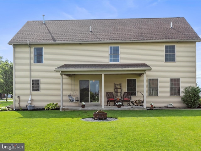 647 Warm Spring Rd, Chambersburg, PA 17202 - rear view of house with an outdoor fire pit, a patio area, and a lawn