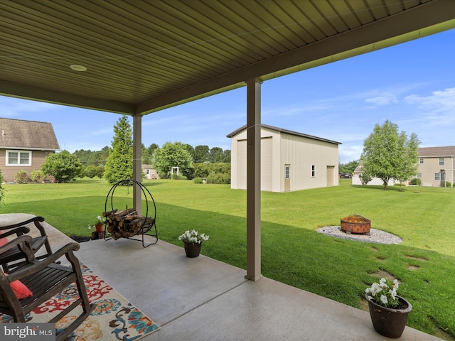 647 Warm Spring Rd, Chambersburg, PA 17202 - view of patio with an outdoor fire pit and an outbuilding