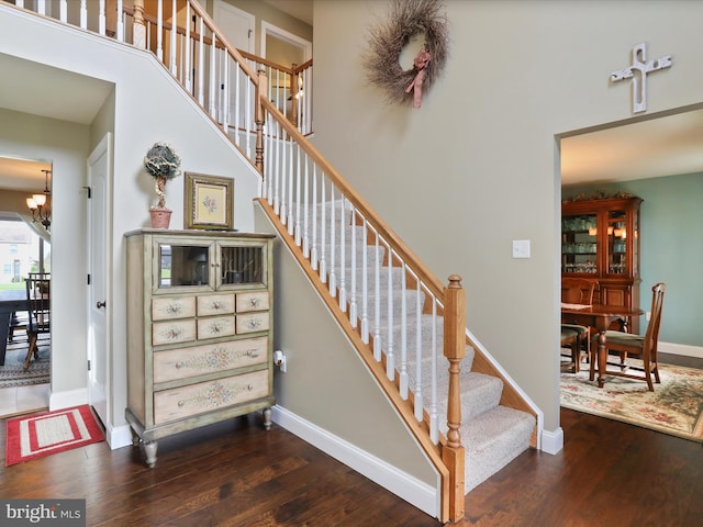 647 Warm Spring Rd, Chambersburg, PA 17202 - stairway with wood finished floors and a chandelier