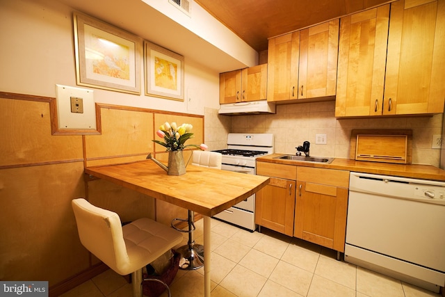 8677 Greenbelt Rd Unit 101, Greenbelt, MD 20770 - kitchen with white appliances, under cabinet range hood, butcher block counters, light tile patterned floors, and tasteful backsplash