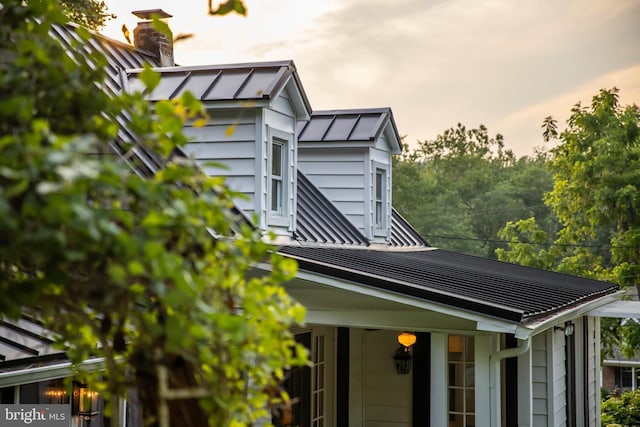 1801 Stringtown Rd, Sparks Glencoe, MD 21152 - exterior view of a chimney, a metal roof, a standing seam roof, and gutters