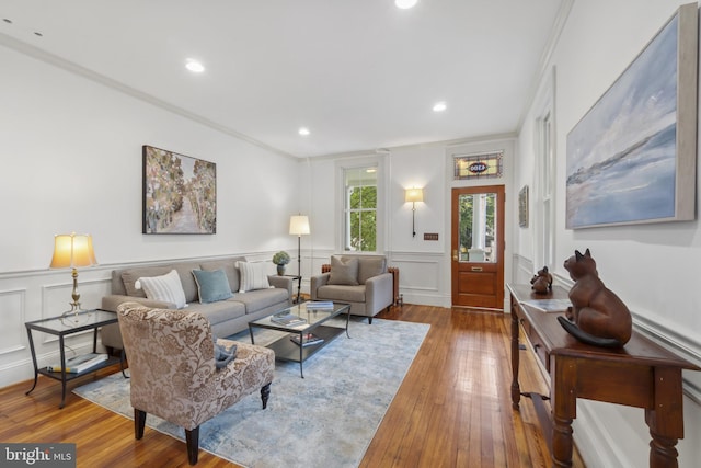 4300 Evans Chapel Rd, Baltimore, MD 21211 - living area featuring crown molding, wood-type flooring, a decorative wall, a wainscoted wall, and recessed lighting