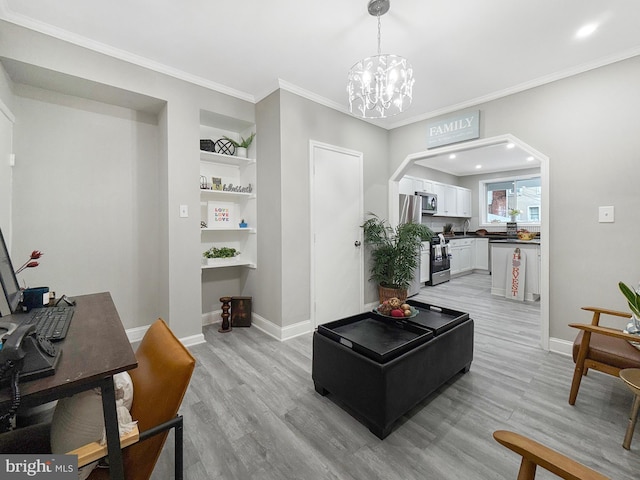 1180 Cleveland St, Baltimore, MD 21230 - living area featuring light wood-style flooring, a desk, a chandelier, crown molding, and recessed lighting