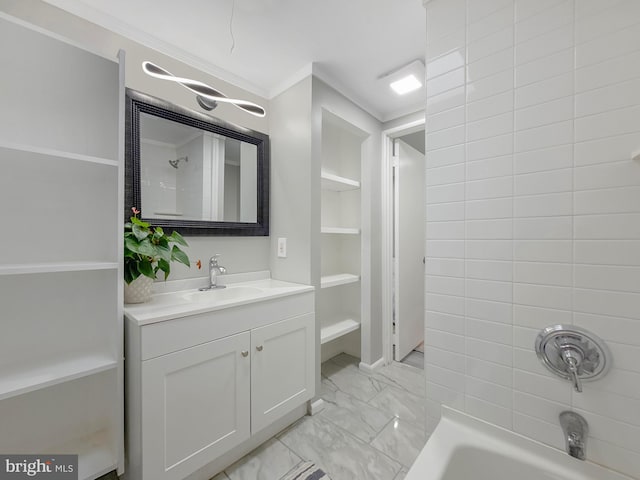 1180 Cleveland St, Baltimore, MD 21230 - full bath featuring vanity, ornamental molding, washtub / shower combination, marble look tiles, and built in shelves