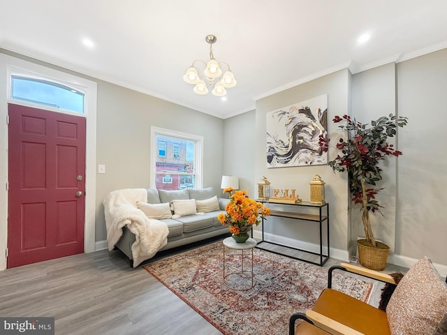 1180 Cleveland St, Baltimore, MD 21230 - living room featuring wood finished floors, healthy amount of natural light, a chandelier, ornamental molding, and recessed lighting