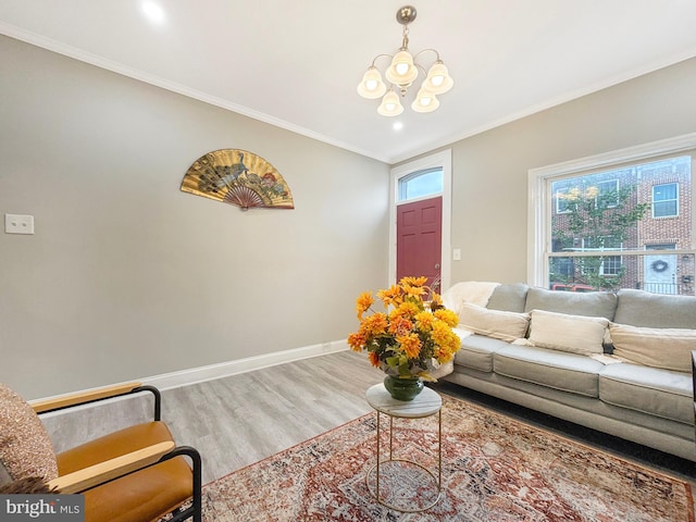 1180 Cleveland St, Baltimore, MD 21230 - living area with a chandelier, plenty of natural light, wood finished floors, and ornamental molding