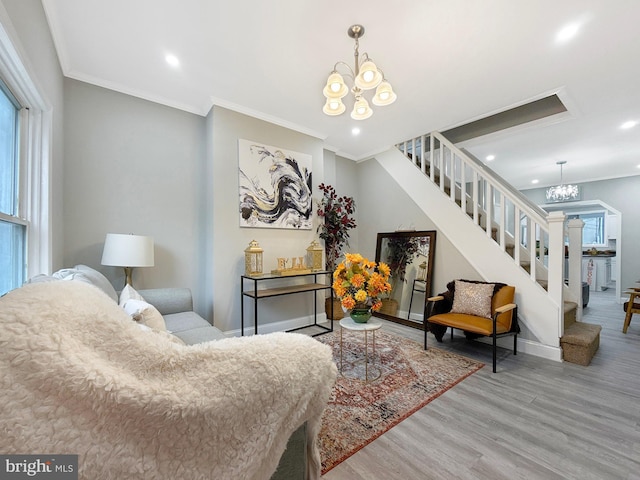 1180 Cleveland St, Baltimore, MD 21230 - living area with a chandelier, stairway, wood finished floors, recessed lighting, and healthy amount of natural light