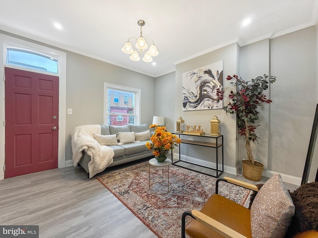 1180 Cleveland St, Baltimore, MD 21230 - living room featuring light wood-type flooring, a chandelier, recessed lighting, and ornamental molding