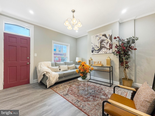 1180 Cleveland St, Baltimore, MD 21230 - living area featuring light wood-style floors, healthy amount of natural light, a chandelier, ornamental molding, and recessed lighting