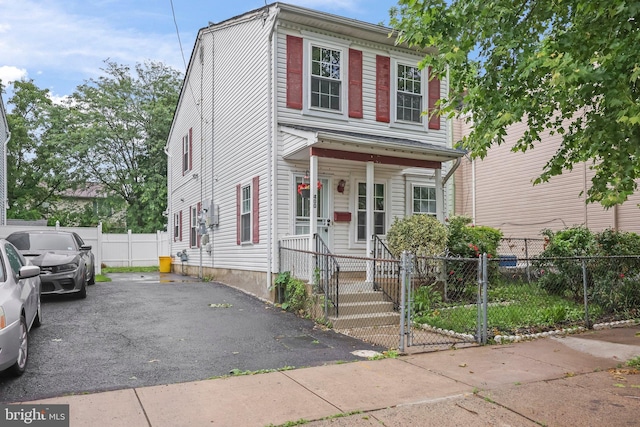 400 Reservoir St, Trenton, NJ 08618 - view of front of house featuring a gate, covered porch, and a fenced front yard