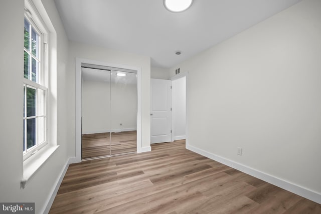 400 Reservoir St, Trenton, NJ 08618 - unfurnished bedroom with wood finished floors and a closet