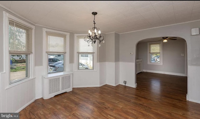 332 E Conestoga Rd, Wayne, PA 19087 - unfurnished dining area featuring arched walkways, radiator, crown molding, wood finished floors, and a chandelier