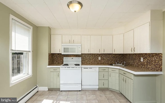 332 E Conestoga Rd, Wayne, PA 19087 - kitchen featuring white appliances, baseboard heating, backsplash, and light countertops