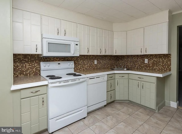 332 E Conestoga Rd, Wayne, PA 19087 - kitchen featuring white appliances, light countertops, tasteful backsplash, and light tile patterned flooring