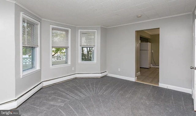 332 E Conestoga Rd, Wayne, PA 19087 - carpeted empty room featuring ornamental molding and a baseboard heating unit