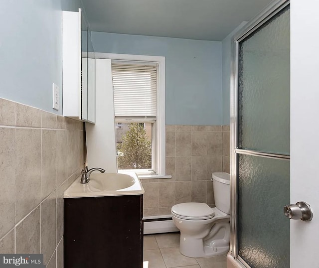 332 E Conestoga Rd, Wayne, PA 19087 - bathroom featuring tile walls, tile patterned floors, a baseboard radiator, vanity, and a shower stall