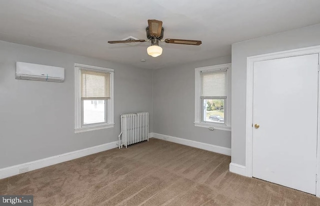 332 E Conestoga Rd, Wayne, PA 19087 - unfurnished bedroom with a wall mounted air conditioner, radiator heating unit, carpet, and ceiling fan