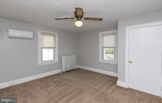 332 E Conestoga Rd, Wayne, PA 19087 - unfurnished bedroom featuring a wall mounted air conditioner, radiator heating unit, carpet, and a ceiling fan