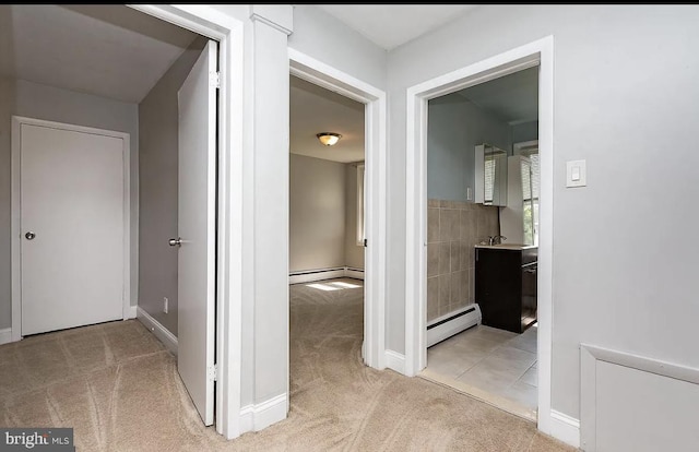 332 E Conestoga Rd, Wayne, PA 19087 - hall featuring a baseboard radiator and light carpet