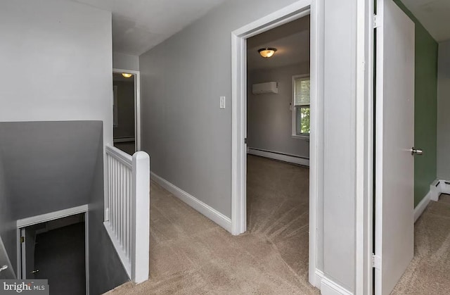 332 E Conestoga Rd, Wayne, PA 19087 - hall with an upstairs landing, light colored carpet, a baseboard radiator, and a wall unit AC