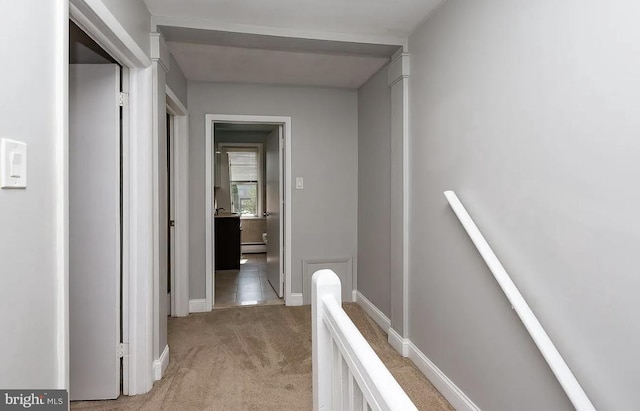 332 E Conestoga Rd, Wayne, PA 19087 - corridor with an upstairs landing, light carpet, and a baseboard radiator