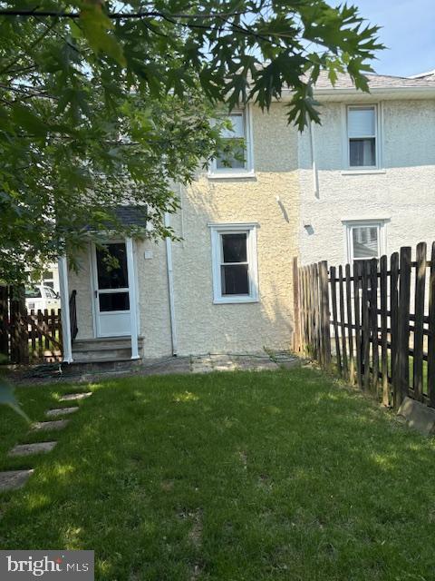 332 E Conestoga Rd, Wayne, PA 19087 - rear view of property featuring stucco siding