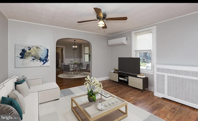 332 E Conestoga Rd, Wayne, PA 19087 - living area with arched walkways, a wall mounted AC, crown molding, ceiling fan, and wood finished floors