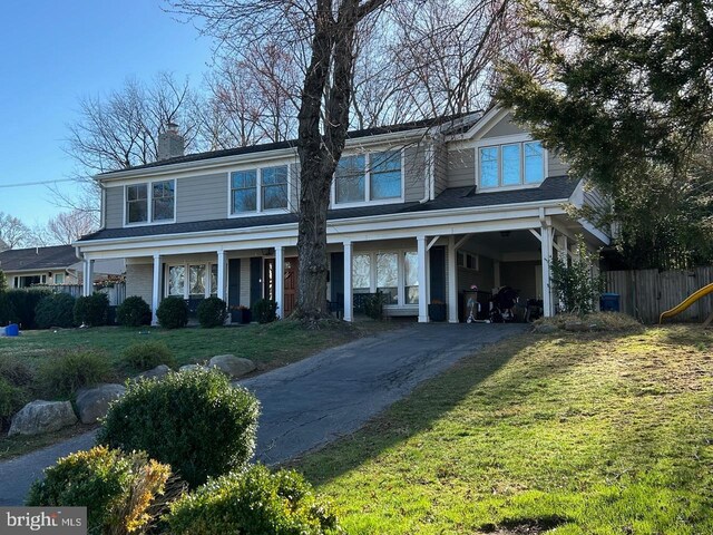 1725 Birch Rd, Mclean, VA 22101 - view of front of home featuring asphalt driveway, a chimney, and a carport