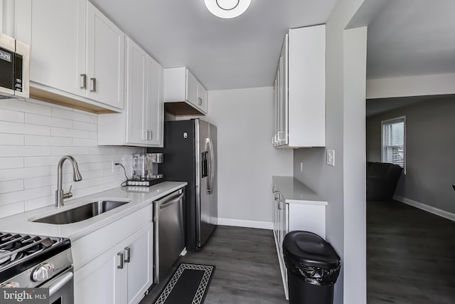 3520 Meadowside Rd, Gwynn Oak, MD 21207 - kitchen featuring appliances with stainless steel finishes, dark wood-type flooring, decorative backsplash, and white cabinets