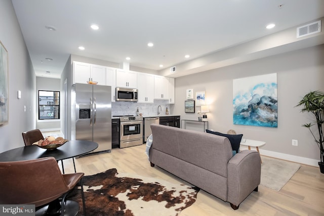 505 Kennedy St NW Unit B02, Washington, DC 20011 - living room featuring light wood-type flooring and recessed lighting